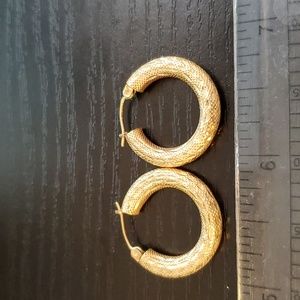 10K hollow gold hoop earrings.